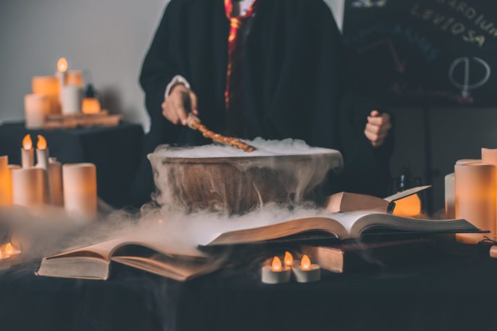 a person sitting at a table in front of a fireplace