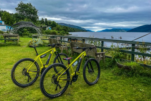 a bicycle parked on the grass