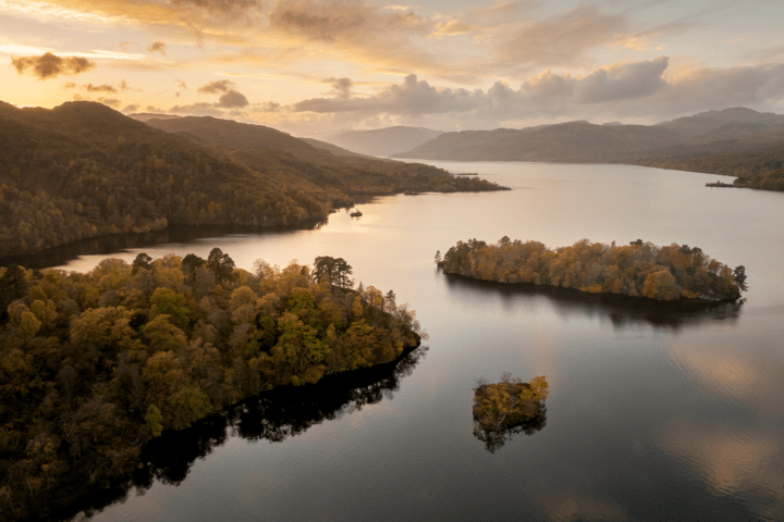 a body of water with a mountain in the background