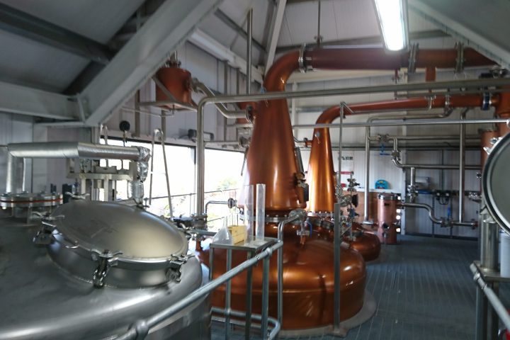 a kitchen with a sink and a chair in a room