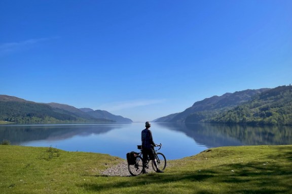 a man riding a horse in a body of water