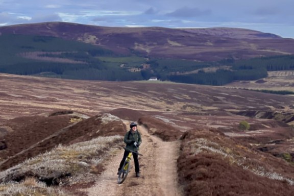 a man riding on top of a mountain