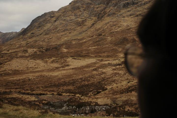a person standing in front of a mountain