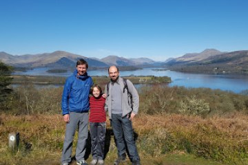 a man standing in front of a mountain
