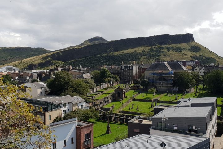 a building with a mountain in the background