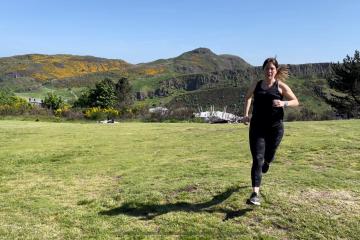 a person throwing a frisbee in a grassy field