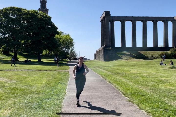 a person riding a skateboard up the side of a road