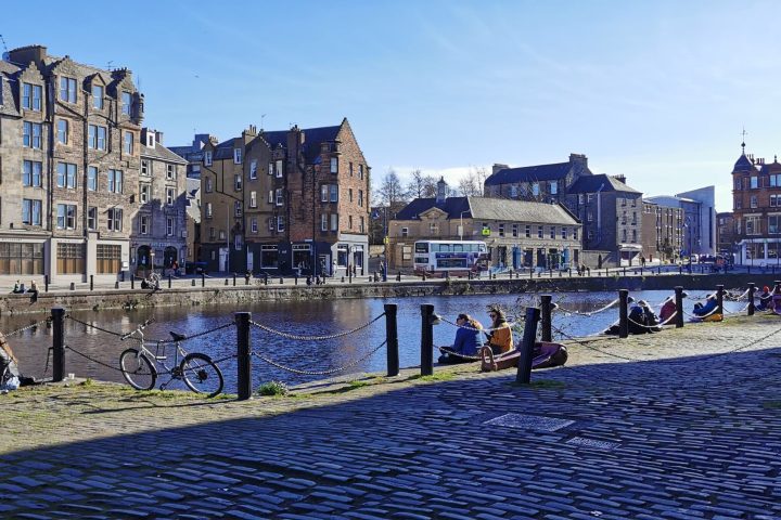 a group of people standing in front of a building