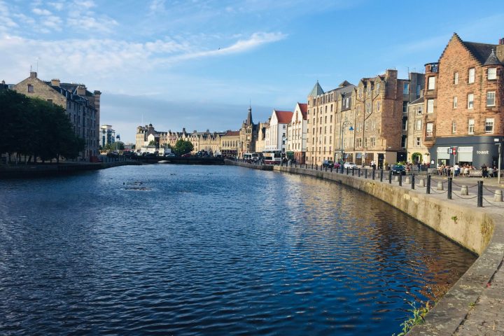 a castle surrounded by a body of water