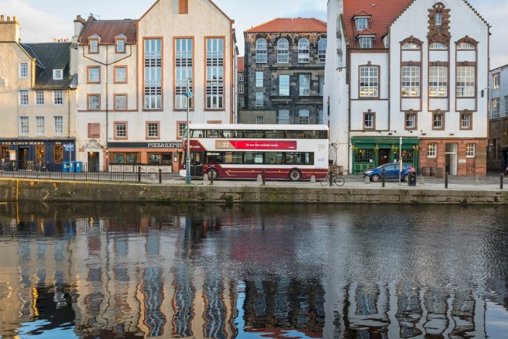 a building next to a body of water