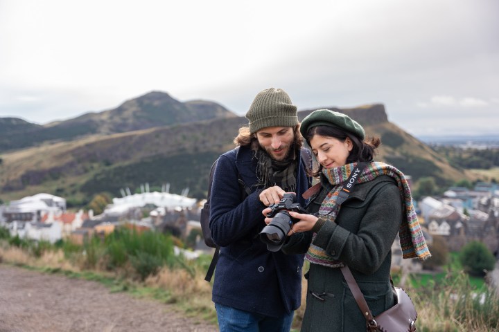 a person standing in front of a mountain