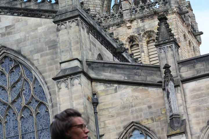 a person standing in front of a church